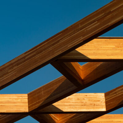 Symmetry of building frame against the blue sky. Architectural symmetry and clean lines.